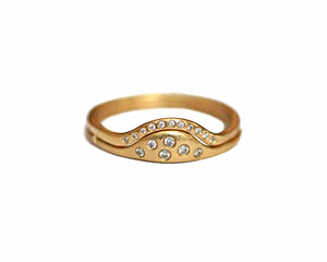Sunrise ring in 14K yellow gold with 11 small round white diamonds in arch shown paired with our Sun ring in 14K yellow gold with white diamonds