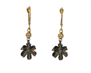 Hanging flower in black oxidized sterling silver with 14K yellow gold bezel with white round diamond and leverback ear component