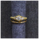 Jocelyn White Sapphire Ring with Textured Diamond band on ring roll.