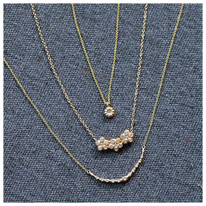 Beatrix necklace in 14K yellow gold with white diamonds with other necklaces sold separately