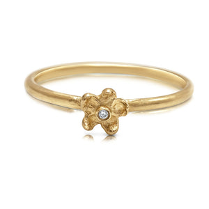 Our Dara ring in 14K yellow gold with round white diamond center stone in flower