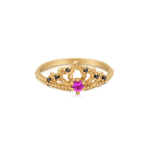 Anya ring in 14K yellow gold with pink sapphire center stone and black diamonds on top of crown design.