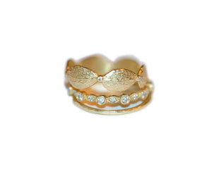 This handcrafted delicate Leaf Band with six 1.5 mm Diamonds with other rings sold separately