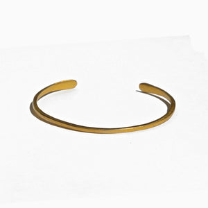 Penelope Cuff Bracelet Available in 14K, 18K or 18K Gold-plated. Our new Penelope Cuff Bracelet is perfect for everyday wear and they are fully adjustable so you can wear them loose or tighter on the wrist.  It measures approximately 2mm wide with rounded ends. Can be ordered in a hammered, plain or Organic Texture.