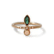 Our Iris ring with a Green Tourmaline marquis, Opal round stone and Diamonds on the side shown in 14K yellow gold.