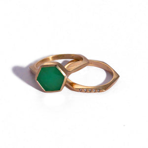 Hexagon center stone ring shown in 14K yellow gold with emerald hexagon shaped center stone. Shown with hexagon band