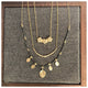 Our leaf Diamond bead necklace shown in 14Kyellow gold with diamond beads shown with other necklaces all sold separately