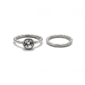 Our Lita ring in 14K white gold with 1ct round white diamond center stone shown with our Lita band
