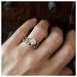Arielle ring in 14K Yellow gold shown with white sapphire center stone and ruby side stones. Coupled with our Lanie ring shown in 14K yellow gold and rubies on finger.