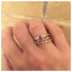 Yinna ring in 14K yellow gold with ruby and diamonds on hand with other rings sold separately