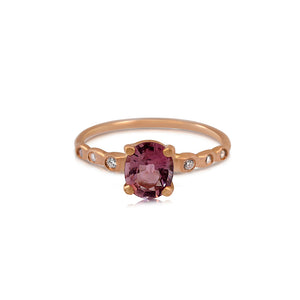 14K rose gold Desi ring with pink tourmaline center stone and 4 gray diamonds on side