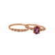 14K rose gold Desi ring with pink tourmaline center stone and 4 gray diamonds on side shown with Desi stone ring in 14K rose gold and gray diamonds