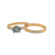 14K yellow gold stella ring with oval aquamarine center stone and 3 pave set diamonds on either side paired with our stellla band in 14K yellow gold and white diamonds