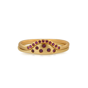 Sunrise ring in 14K yellow gold with 11 small round rubies in arch paired with Sun ring with ruby stones