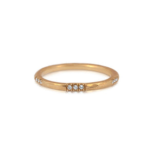 Textured diamond band in 14K yellow gold with 15 white round diamonds in 5 sets of 3 around the band