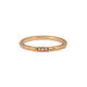 Textured diamond band in 14K yellow gold with 15 white round diamonds in 5 sets of 3 around the band