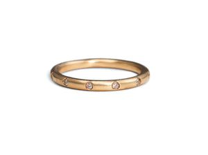 Pippa ring shown in 14K yellow gold with white diamonds all around