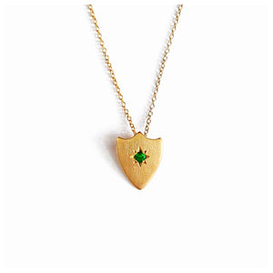 shield necklace is shown in 14K Yellow Gold with a green emerald center stone