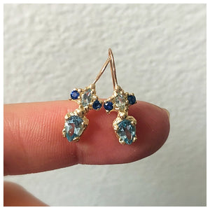 tina earrings shown with Blue sapphires and a Aqua Pear Stone.