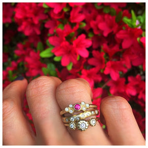 Yinna ring in 14K yellow gold with ruby and diamonds shown with other rings sold separately