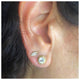 Jocelyn Earrings in 14K yellow gold with white sapphires with round white sapphire stones in each shown in ear