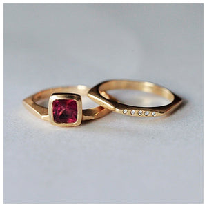 Shown in 14K yellow gold with square pink tourmaline center stone on hexagon shaped band paired with  hexagon band with diamonds