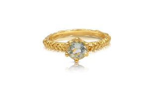 Our Audrey Ring shown with a light green tourmaline center stone in 14K Yellow gold.