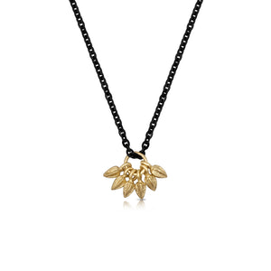 This necklace features 6 14K yellow gold buds on a rhodium plated silver chain.