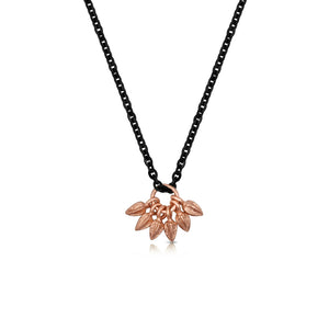 This necklace features 6 14K rose  gold buds on a rhodium plated silver chain.