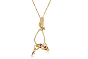 Our hand charm holder in 14K yellow gold with white diamonds shown holding 3 charms not included