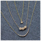 Our Laura necklace This beautiful flower pendant features 3 flowers together that each feature 6 brilliant diamonds in each flower and hangs from an 16" gold chain shown with other necklaces.