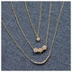 Beatrix necklace in 14K yellow gold with white diamonds with other necklaces sold separately