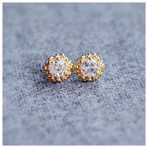 Jocelyn Earrings in 14K yellow gold with white sapphires with round white sapphire stones in each on gray background