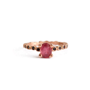 Dot Pink Tourmaline with Black Diamond side stones shown in 14K Rose gold