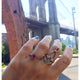Yinna ring in 14K yellow gold with ruby and diamonds shown with other rings sold separately