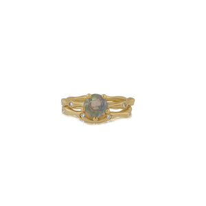 Seaweed bud center stone ring in 14k yellow gold with 1ct round opal center stone paired with 14K yellow seaweed bud wedding ring with white diamonds