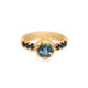 Yolanda with blue aquamarine center stone and Black Diamond side stones shown in 14K Yellow gold.