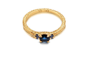 Top view of constance ring in 14K yellow gold with 3 blue sapphires