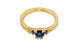 Top view of constance ring in 14K yellow gold with 3 blue sapphires