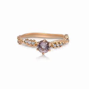 Anais ring in 14K rose gold with round pink tourmaline center stone and 7 gray diamonds along the band