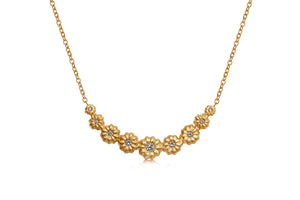 Our blossom nine diamond necklace  shown in 14K yellow gold with white diamond