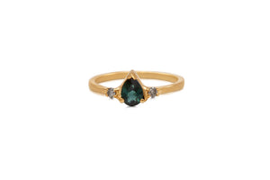 14K yellow gold Marina ring with pear shaped blue tourmaline center stone and 2 gray diamonds on side