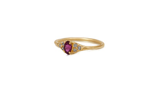 side view Mina ring in 14K yellow gold with pink tourmaline oval center and 6 gray side diamonds