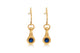 Evelyn earrings shown in 14K yellow gold with round blue sapphire in each