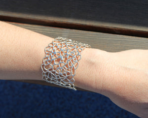 Handmade Fine Jewelry Lace Cuff in sterling silver worn on wrist
