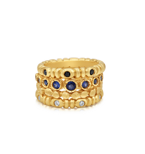 2 mimi rings stacked with 2 other rings all in 14K Yellow gold