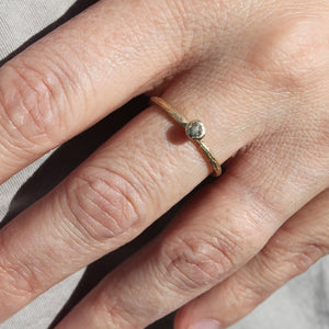 14K yellow gold twig rough diamond ring worn on finger