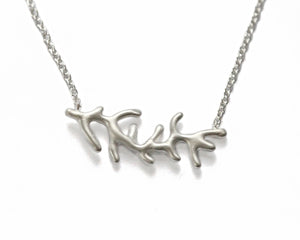 This elegant necklace is shown in sterling silver. This elegant necklace is shown in sterling silver. It can be paired with our Long Coral Earrings, or Coral Long Ring  The handcrafted coral pendant measures 1 1/4 of an inch across﻿ and hangs from a 16" chain.