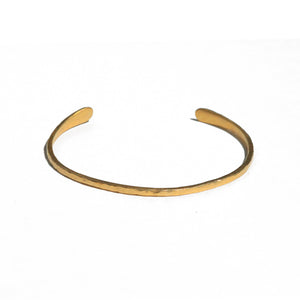 Penelope Cuff Bracelet Available in 14K, 18K or 18K Gold-plated. Our new Penelope Cuff Bracelet is perfect for everyday wear and they are fully adjustable so you can wear them loose or tighter on the wrist.  It measures approximately 2mm wide with rounded ends. Can be ordered in a hammered, plain or Organic Texture.