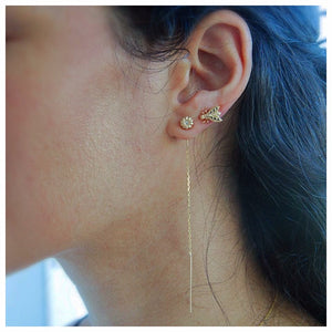 Blossom threader earring in 14K yellow gold with one round white diamond in each shown in ear